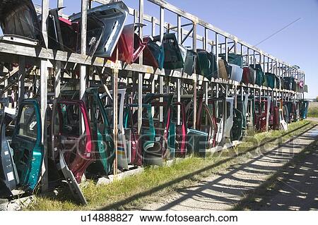 Car doors for sale at a junkyard, Saskatchewan View Large Photo Image Stock Photo - Car doors for sale at a junkyard, Saskatchewan. Fotosearch