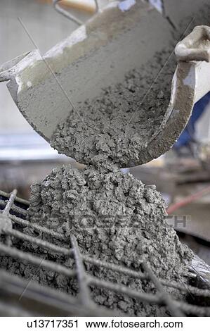 Stock Image - Cement pouring out of mixer; Canada, Ontario, Hamilton (Composting Facility). Fotosearch