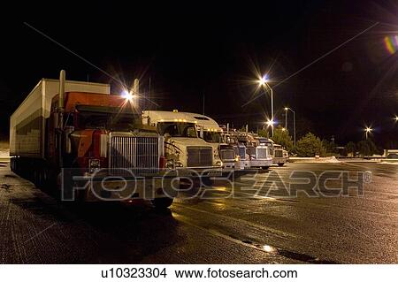 Parking lot for transport trucks at night; Canada, Ontario View Large Photo Image Picture - Parking lot for transport trucks at night; Canada, Ontario. Fotosearch