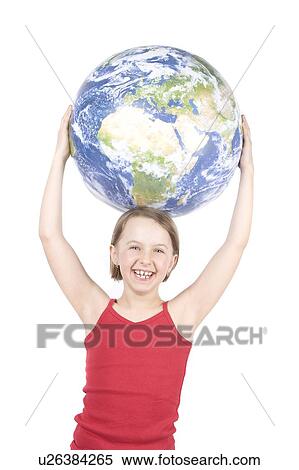 Stock Photography - 9 year girl with the globe on her head. Fotosearch