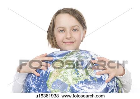 Stock Photo - 9 year old girl with globe. Fotosearch
