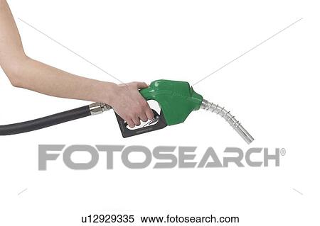 Stock Photography - a hand with a gasoline nozzle. Fotosearch