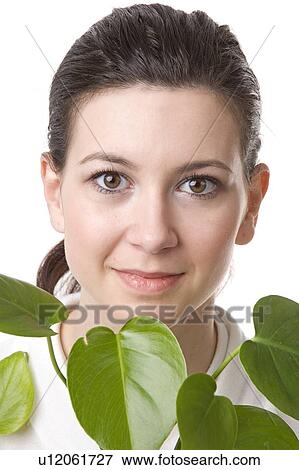 face of a young woman with leaves View Large Photo Image Stock Photo - face of a young woman with leaves. Fotosearch