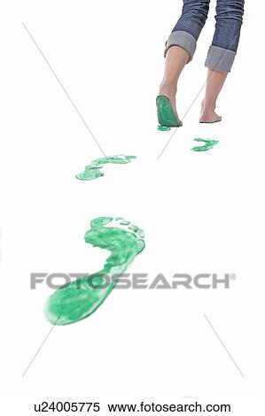 Feet walking leaving a set of green footprints View Large Photo Image Stock Photography - Feet walking leaving a set of green footprints. Fotosearch