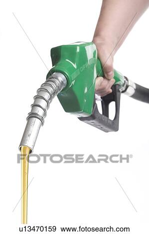 Hand holds gas nozzle with gas flowing out View Large Photo Image Stock Photo - Hand holds gas nozzle with gas flowing out. Fotosearch
