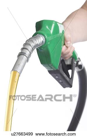 Hand holds gas nozzle with gas flowing out View Large Photo Image Stock Photo - Hand holds gas nozzle with gas flowing out. Fotosearch