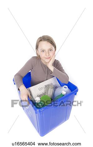 Picture - recycling box with the girl inside. Fotosearch