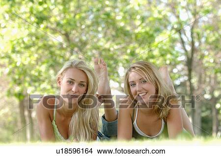 2 young blonde females in park, Regina, Saskatchewan View Large Photo Image Picture - 2 young blonde females in park, Regina, Saskatchewan. Fotosearch