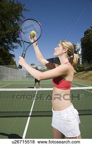 Couple playing tennis; Canada, British Columbia, Vancouver View Large Photo Image Stock Photo - Couple playing tennis; Canada, British Columbia, Vancouver. Fotosearch