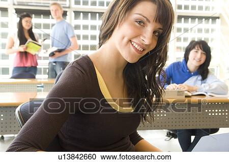 Female student foreground, group of students in background, in fron of solar panelled windows, Winnipeg, Canada. View Large Photo Image Stock Image - Female student foreground, group of students in background, in fron of solar panelled windows, Winnipeg, Canada.. Fotosearch