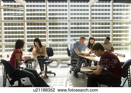 Groups of students casually seated at tables in front of solar panelled windows, Winnipeg, Canada. View Large Photo Image Stock Image - Groups of students casually seated at tables in front of solar panelled windows, Winnipeg, Canada.. Fotosearch