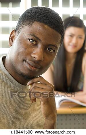 Male student foreground, female student background, in front of solar panelled windows, Winnipeg, Canada View Large Photo Image Stock Image - Male student foreground, female student background, in front of solar panelled windows, Winnipeg, Canada. Fotosearch