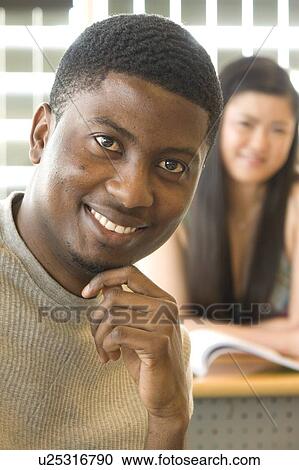 Male student foreground, female student background, in front of solar panelled windows, Winnipeg, Canada View Large Photo Image Stock Image - Male student foreground, female student background, in front of solar panelled windows, Winnipeg, Canada. Fotosearch