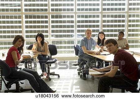 Portrait of students casually seated at tables in front of solar panelled windows, Winnipeg, Canada View Large Photo Image Stock Photograph - Portrait of students casually seated at tables in front of solar panelled windows, Winnipeg, Canada. Fotosearch