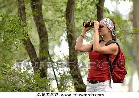 Woman in woods with binoculars, Regina, Saskatchewan View Large Photo Image Stock Photo - Woman in woods with binoculars, Regina, Saskatchewan. Fotosearch