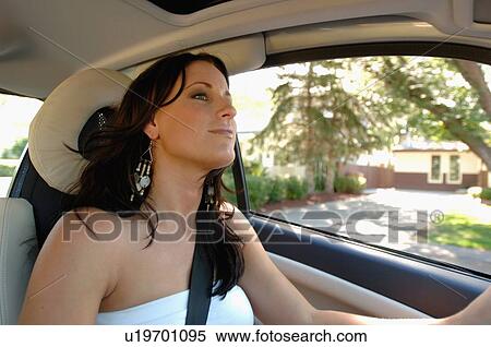 Young woman driving smartcar, Regina, Saskatchewan View Large Photo Image Stock Photography - Young woman driving smartcar, Regina, Saskatchewan. Fotosearch