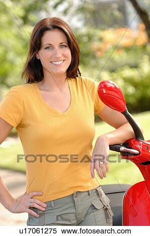 Young woman posing with red vespa, Regina, Saskatchewan View Large Photo Image Stock Photography - Young woman posing with red vespa, Regina, Saskatchewan. Fotosearch
