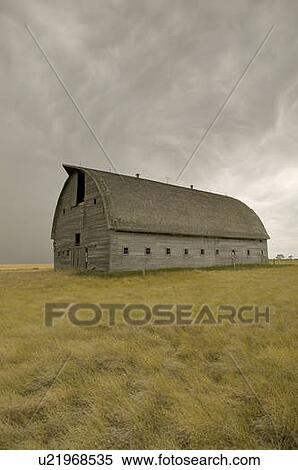 Stock Photography - Large unpainted barn on the prairies, Ceylon, Saskatchewan. Fotosearch