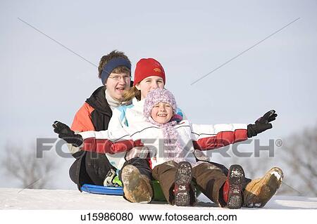 15, 13 and 9 year olds prepare to slide down hill, Winnipeg, Canada View Large Photo Image Stock Image - 15, 13 and 9 year olds prepare to slide down hill, Winnipeg, Canada. Fotosearch
