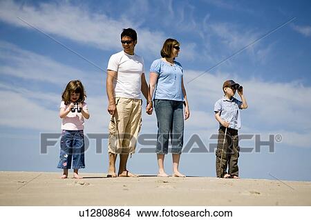 Family taking a walk on the sand, Grand Beach Provincial Park, Manitoba, Canada View Large Photo Image Picture - Family taking a walk on the sand, Grand Beach Provincial Park, Manitoba, Canada. Fotosearch