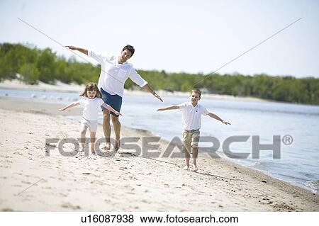 Man and 2 children running along shoreline, Grand Beach Provincial Park, Manitoba, Canada View Large Photo Image Stock Photo - Man and 2 children running along shoreline, Grand Beach Provincial Park, Manitoba, Canada. Fotosearch