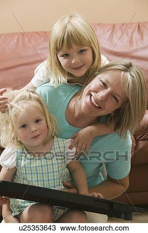 Stock Image - Mom and her 3 and 5 year old daughters, B. C.. Fotosearch