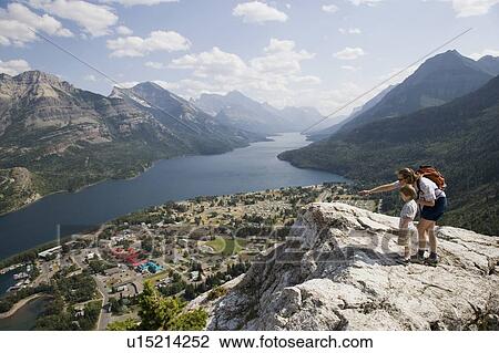 Mother and child enjoy view at Waterton Lakes National Park, Alberta Canada View Large Photo Image Stock Image - Mother and child enjoy view at Waterton Lakes National Park, Alberta Canada. Fotosearch
