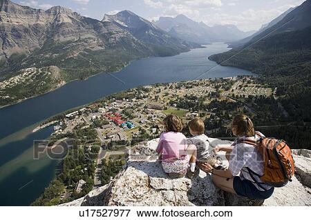 Mother and children enjoy view at Waterton Lakes National Park, Alberta Canada View Large Photo Image Stock Photo - Mother and children enjoy view at Waterton Lakes National Park, Alberta Canada. Fotosearch