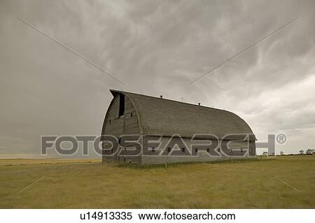 Stock Photography - Large unpainted barn on the prairies, Ceylon, Saskatchewan. Fotosearch