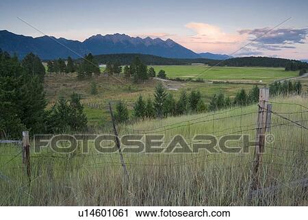 Rural farmland and rocky mountains, Cranbrook, BC, Canada View Large Photo Image Stock Image - Rural farmland and rocky mountains, Cranbrook, BC, Canada. Fotosearch