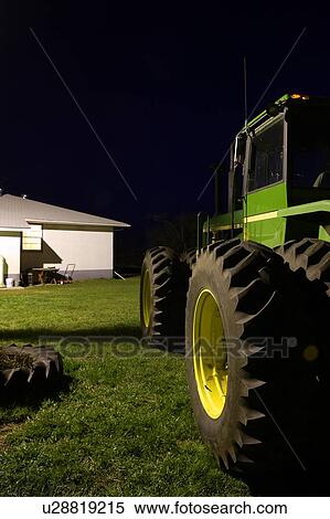 Tractor in farmyard at night, Outlook, Saskatchewan, Canada View Large Photo Image Stock Photography - Tractor in farmyard at night, Outlook, Saskatchewan, Canada. Fotosearch