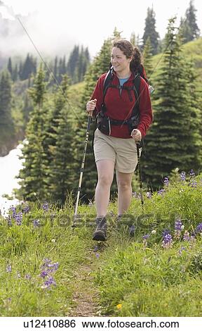 Stock Photograph - A woman hiker on the High Divide Trail on Olympic National Park. Fotosearch