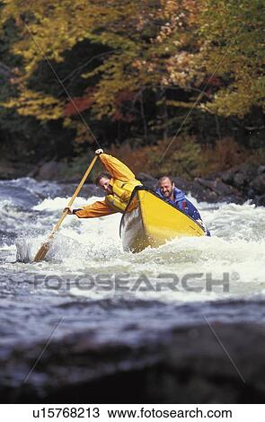 couple paddle whitewater canoe through rapids on Oxtongue river, Ontario, Canada View Large Photo Image Stock Image - couple paddle whitewater canoe through rapids on Oxtongue river, Ontario, Canada. Fotosearch