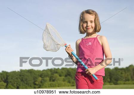Stock Image - Girl - 6 years old with the net in the park, Winnipeg, Canada. Fotosearch
