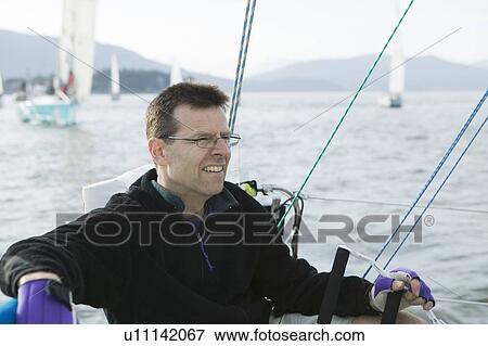 Stock Photo - Sail racing, West Vancouver Yacht Club, West Vancouver, BC Canada. Fotosearch