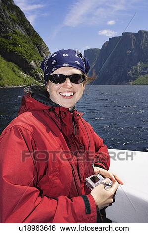 View of woman on boat tour, Western Brook Pond, Gros Morne NP, Newfoundland, Canada View Large Photo Image Stock Photograph - View of woman on boat tour, Western Brook Pond, Gros Morne NP, Newfoundland, Canada. Fotosearch