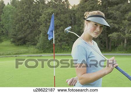 Stock Photo - Woman on organic golf course, Clear Lake Golf Course, Riding Mountain National Park, Manitoba, Canada. Fotosearch