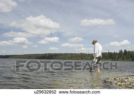 Woman wading in Clear Lake; Canada, Manitoba, Riding Mountain National Park View Large Photo Image Stock Image - Woman wading in Clear Lake; Canada, Manitoba, Riding Mountain National Park. Fotosearch