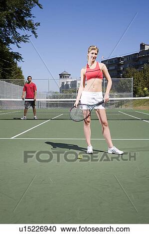 Couple on tennis court; Canada, British Columbia, Vancouver View Large Photo Image Stock Image - Couple on tennis court; Canada, British Columbia, Vancouver. Fotosearch