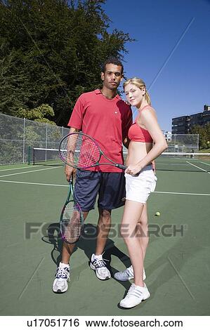 Couple on tennis court; Canada, British Columbia, Vancouver View Large Photo Image Stock Photograph - Couple on tennis court; Canada, British Columbia, Vancouver. Fotosearch