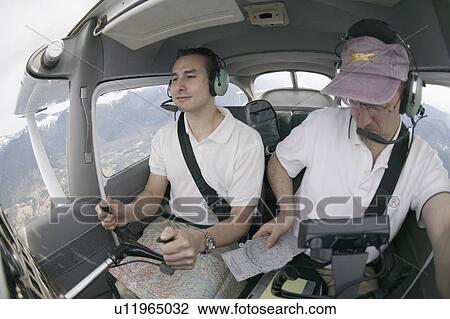 Pilots in a Cessna 172 In Flight, Vancouver, B. C. View Large Photo Image Stock Image - Pilots in a Cessna 172 In Flight, Vancouver, B. C.. Fotosearch