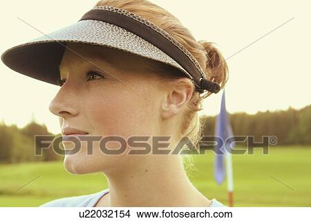 Picture - Woman on organic golf course, Clear Lake Golf Course, Riding Mountain National Park, Manitoba, Canada. Fotosearch