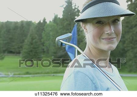 Stock Photograph - Woman on organic golf course, Clear Lake Golf Course, Riding Mountain National Park, Manitoba, Canada. Fotosearch