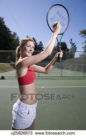 Woman readies to serve at tennis; Canada, British Columbia, Vancouver View Large Photo Image Stock Image - Woman readies to serve at tennis; Canada, British Columbia, Vancouver. Fotosearch