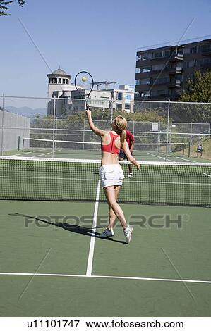 Young couple play tennis on public tennis courts, Vancouver, British Columbia View Large Photo Image Stock Photo - Young couple play tennis on public tennis courts, Vancouver, British Columbia. Fotosearch
