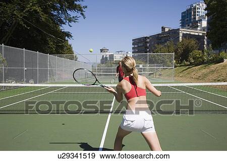 Young couple play tennis on public tennis courts, Vancouver, British Columbia View Large Photo Image Stock Photo - Young couple play tennis on public tennis courts, Vancouver, British Columbia. Fotosearch