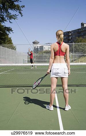 Young couple play tennis on public tennis courts, Vancouver, British Columbia View Large Photo Image Stock Photo - Young couple play tennis on public tennis courts, Vancouver, British Columbia. Fotosearch