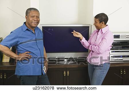 African American couple installing a flat screen TV, Vancouver, BC View Large Photo Image Stock Photo - African American couple installing a flat screen TV, Vancouver, BC. Fotosearch