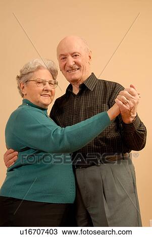 Stock Image - Senior Couple Dancing; Canada, Saskatchewan, Regina. Fotosearch