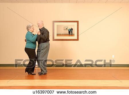 Stock Photo - Senior Couple Dancing; Canada, Saskatchewan, Regina. Fotosearch